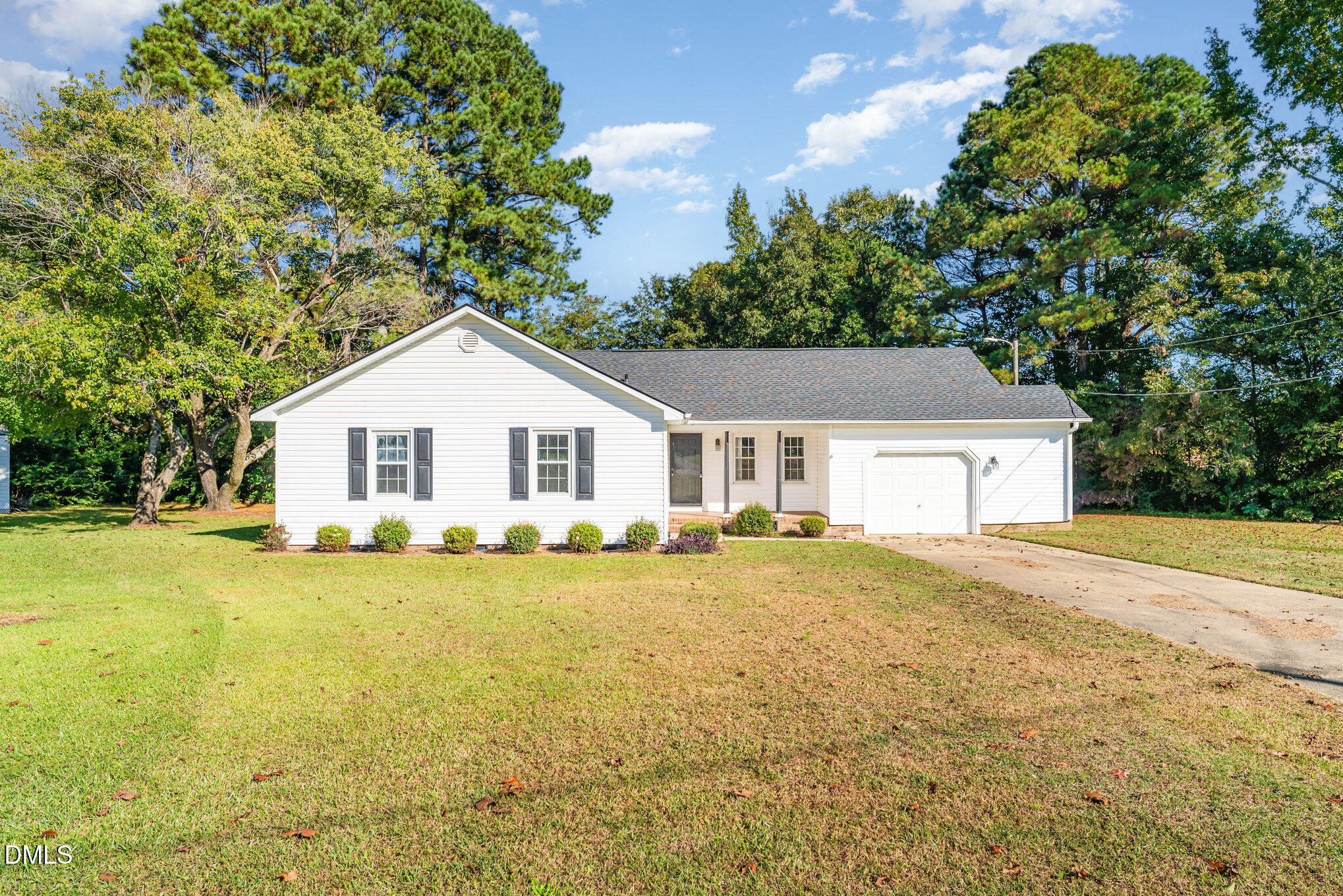 110 Rose Circle Dunn, NC 28334 - Photo 4 of 37 a view of a house with a yard and large tree