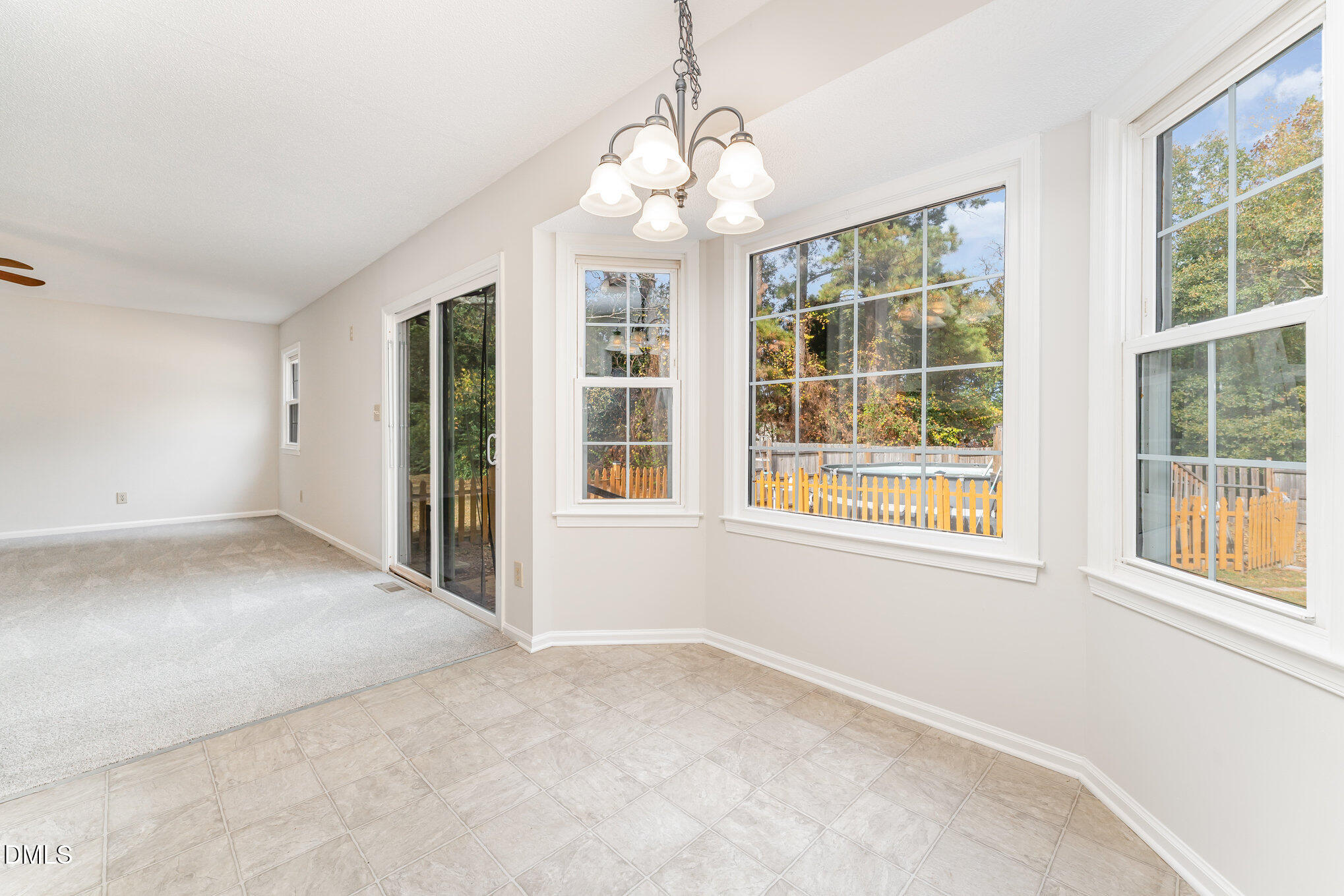 110 Rose Circle Dunn, NC 28334 - Photo 10 of 37 an empty room with windows and entrance