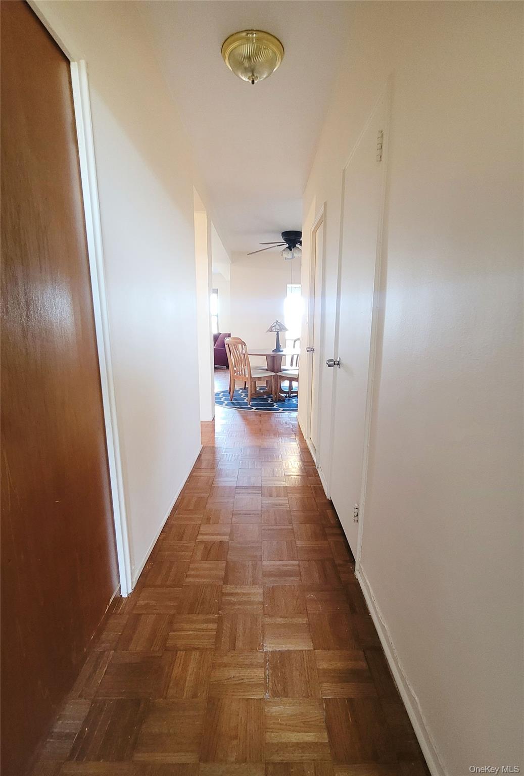 99-72 66th Road, Unit 7AA Queens, NY 11374 - Photo 7 of 19 Hallway featuring baseboards