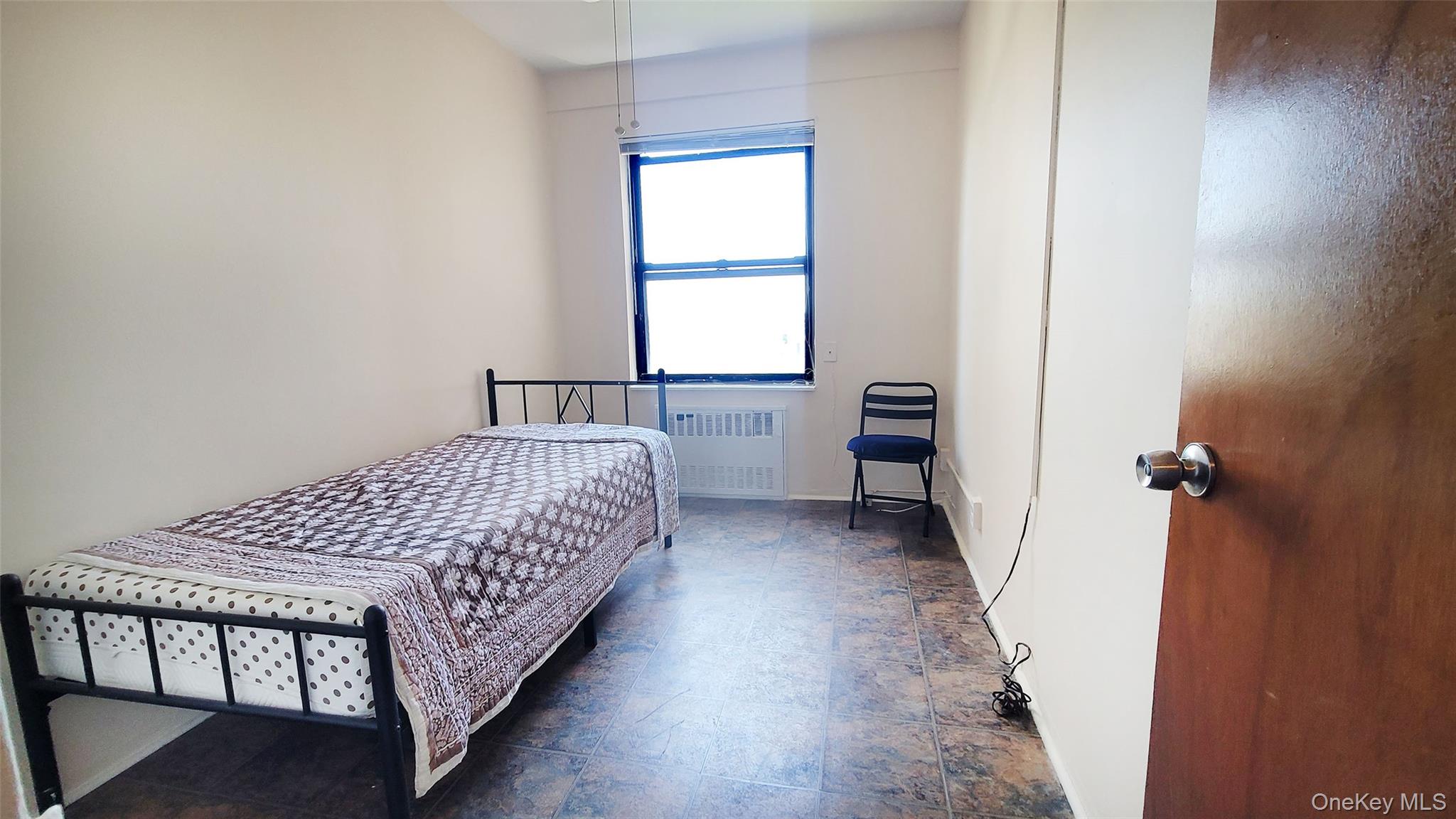 99-72 66th Road, Unit 7AA Queens, NY 11374 - Photo 9 of 19 Bedroom featuring radiator and baseboards