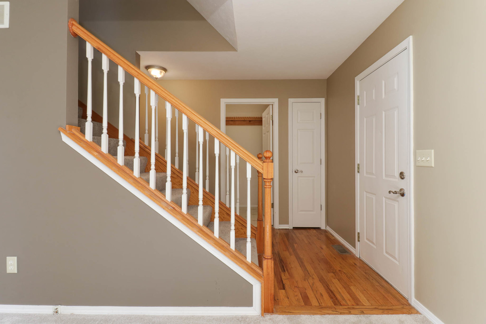 230 Parktrail Road Normal, IL 61761 - Photo 14 of 37 a view of a hallway with wooden floor and staircase