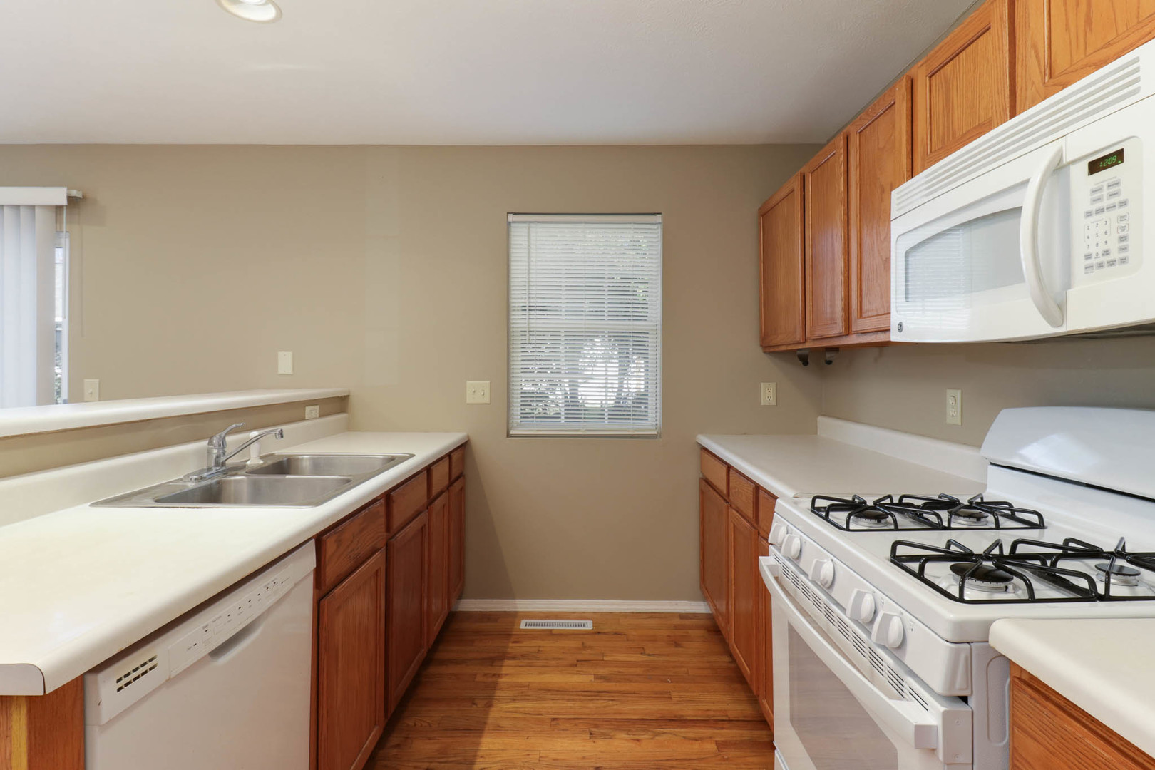 230 Parktrail Road Normal, IL 61761 - Photo 9 of 37 a kitchen with a sink stove top oven and cabinets