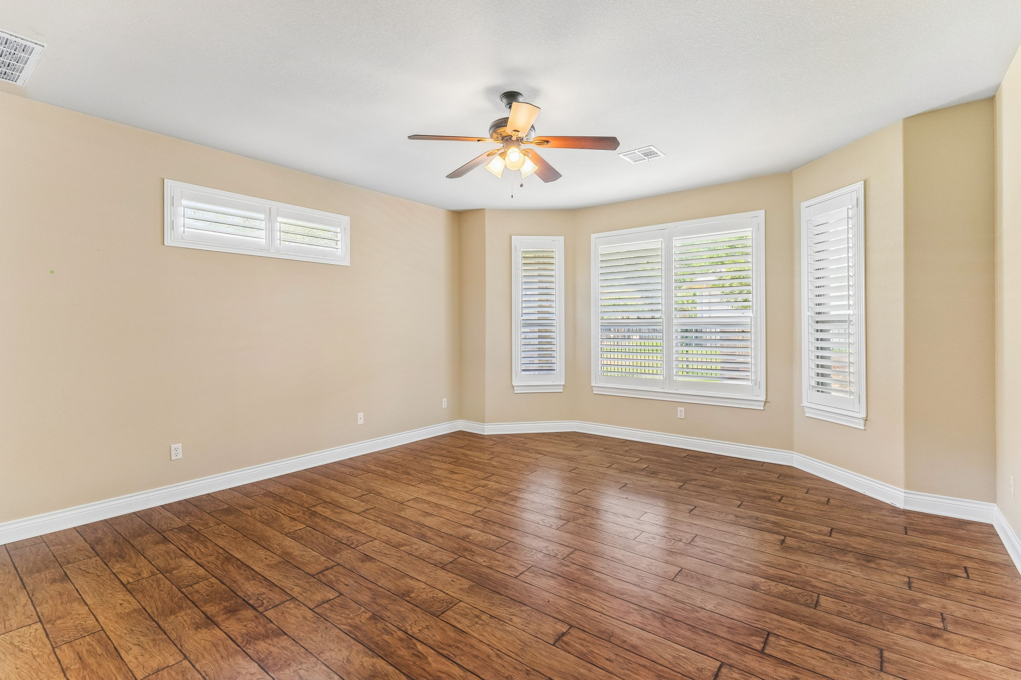 4802 Hidden Springs Trail Georgetown, TX 78633 - Photo 15 of 38 Master Bedroom -Downstairs - check out how these beautiful floors fill up the home