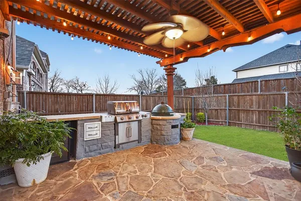 a view of a backyard with sitting area