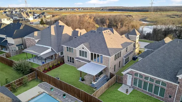 an aerial view of a house with a lake view