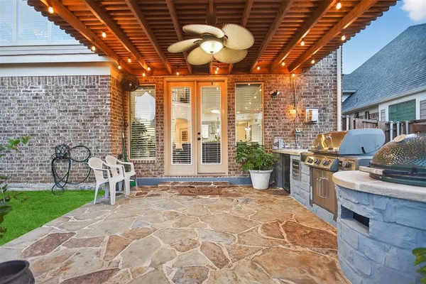 a view of a kitchen with a stove and a grill