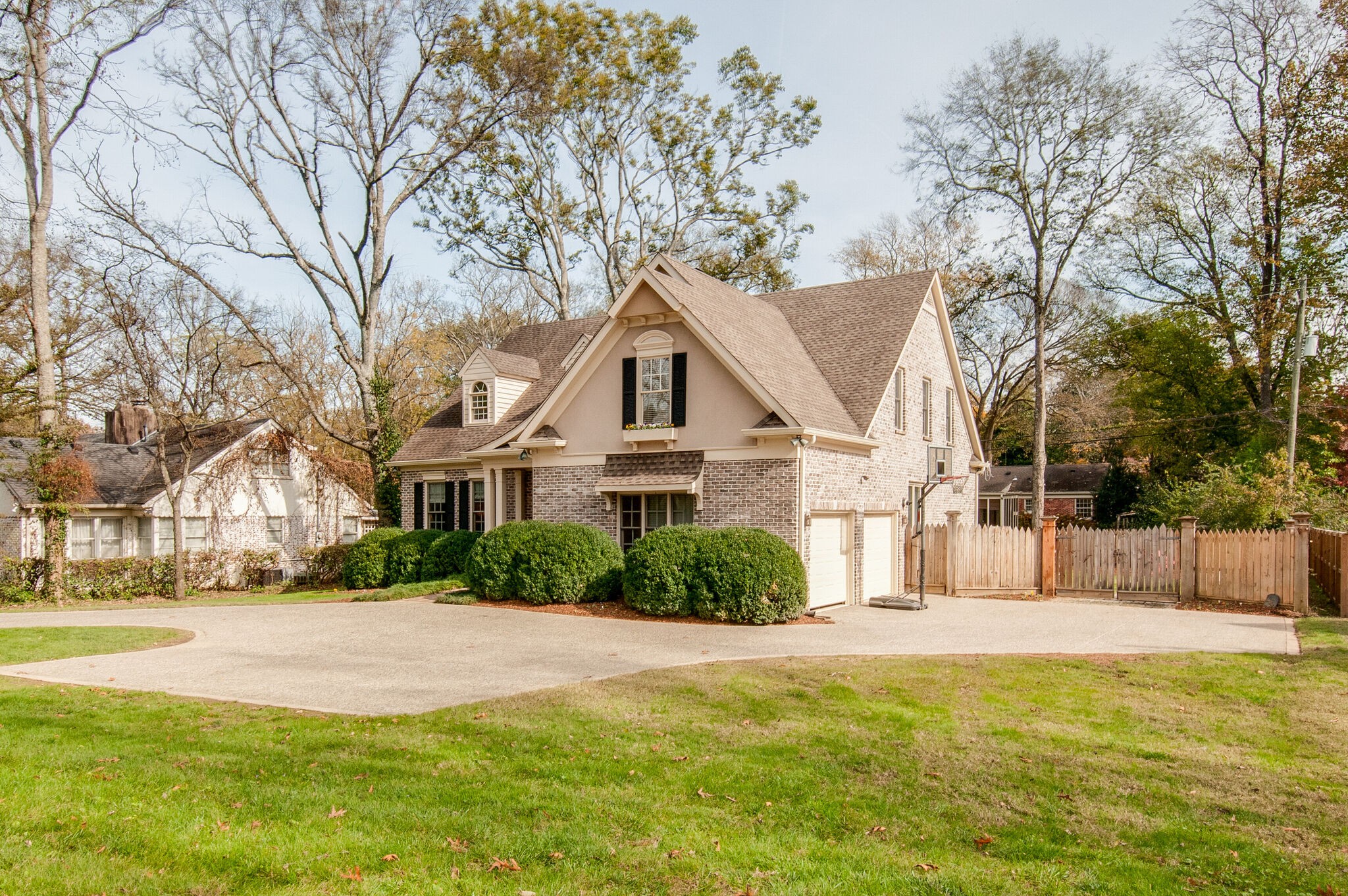 302 Page Road Nashville, TN 37205 - Photo 2 of 42 a front view of house with yard and trees around