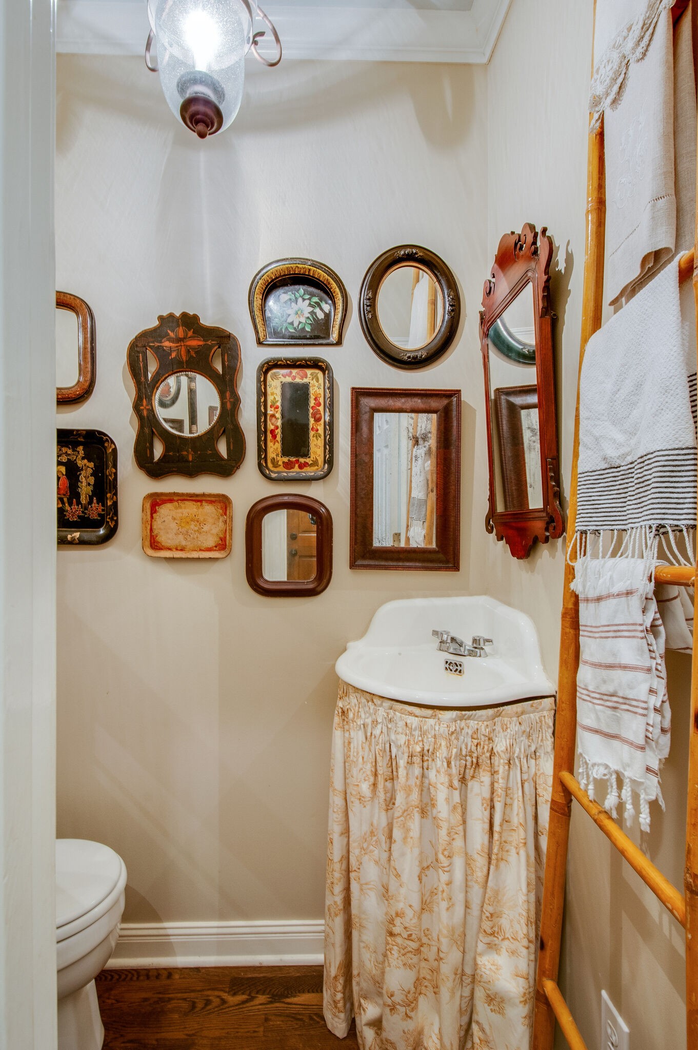 302 Page Road Nashville, TN 37205 - Photo 11 of 42 a bathroom with a sink a toilet and a mirror