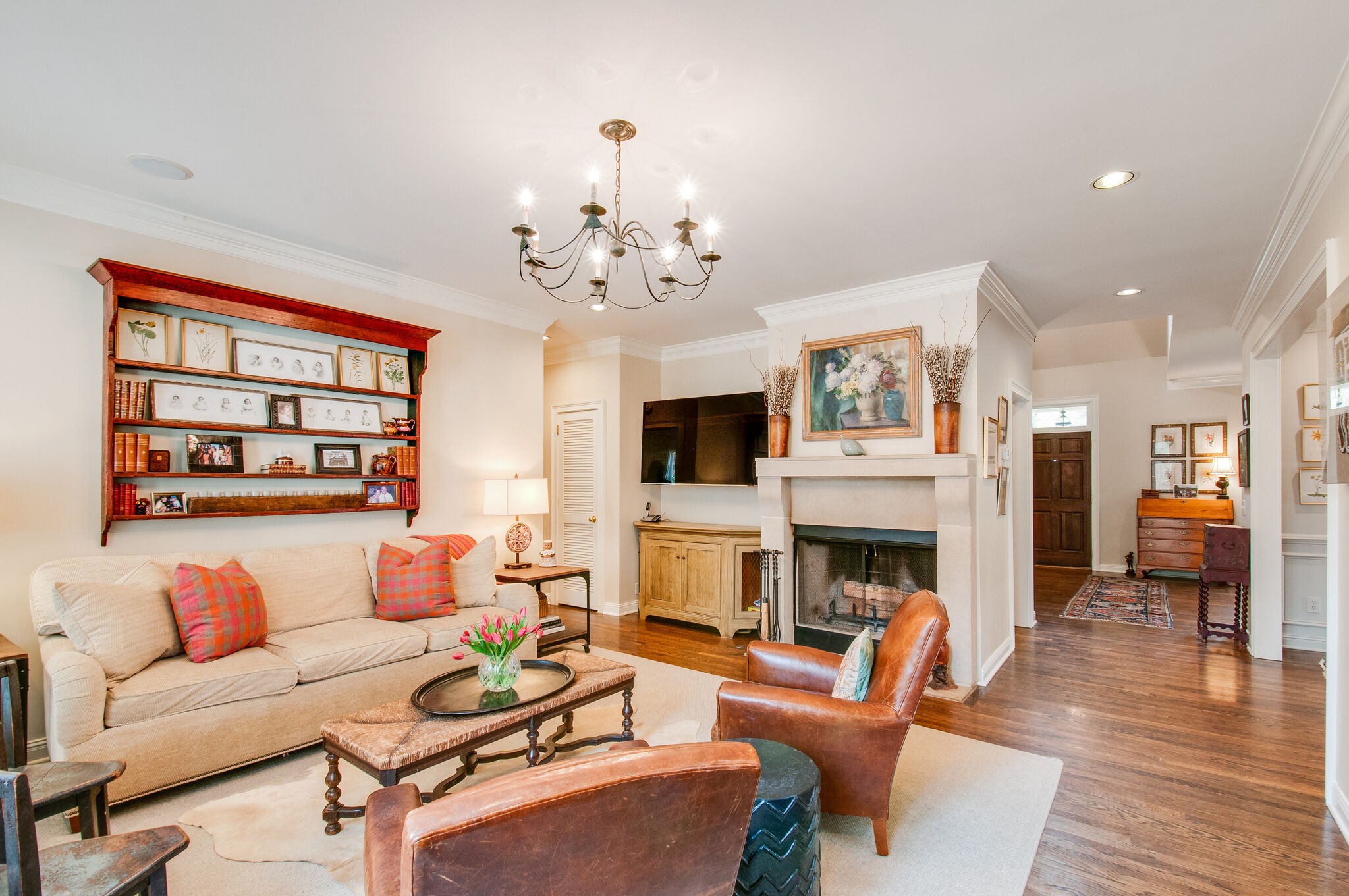 302 Page Road Nashville, TN 37205 - Photo 13 of 42 a living room with furniture a fireplace and a dining table with wooden floor
