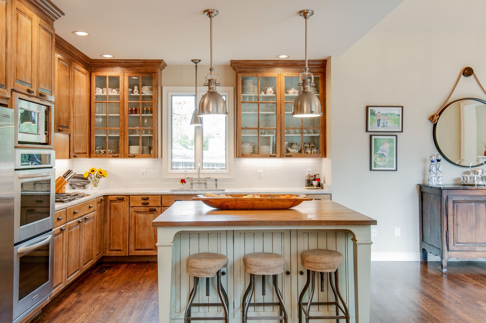 302 Page Road Nashville, TN 37205 - Photo 14 of 42 a kitchen with a table chairs sink and cabinets