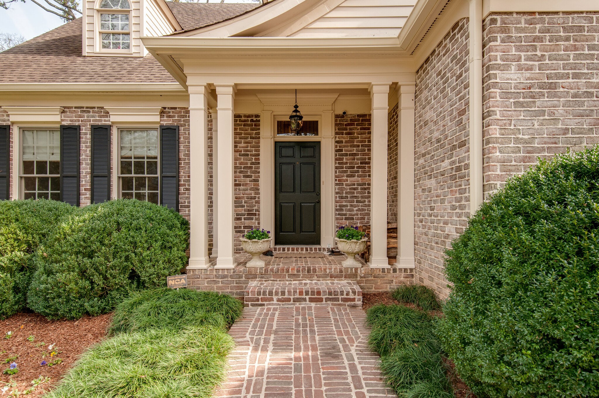 302 Page Road Nashville, TN 37205 - Photo 3 of 42 front view of a house with a large window