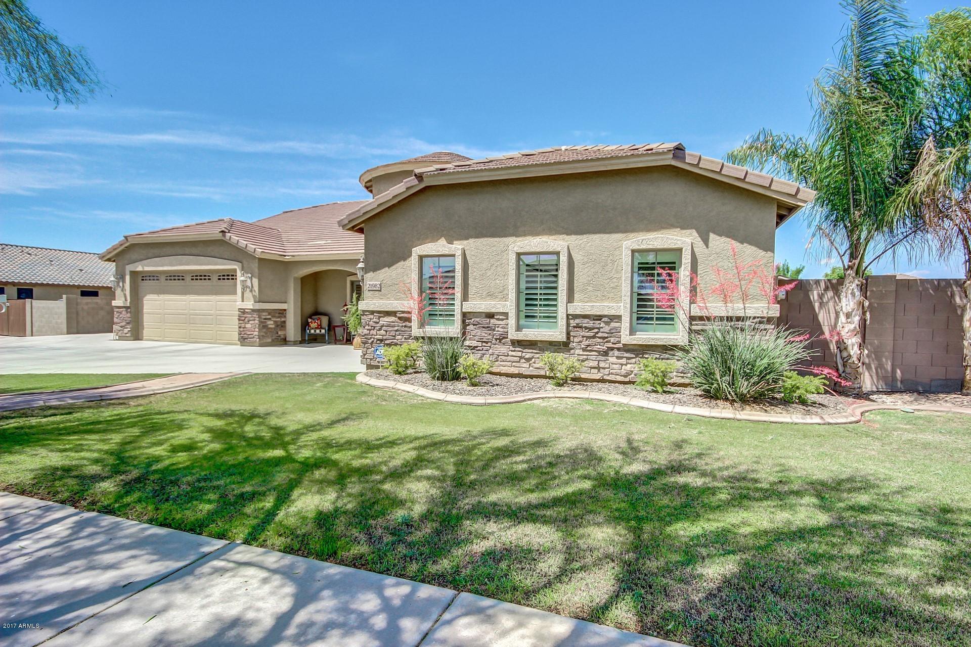 21982 East Rosa Road Queen Creek, AZ 85142 - Photo 1 of 40 a front view of a house with garden