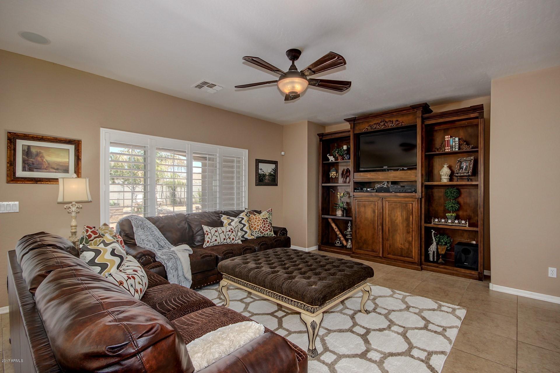 21982 East Rosa Road Queen Creek, AZ 85142 - Photo 14 of 40 a living room with furniture and a window