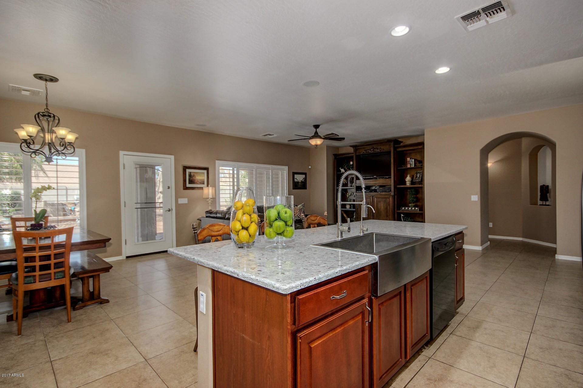 21982 East Rosa Road Queen Creek, AZ 85142 - Photo 17 of 40 a kitchen that has a lot of cabinets in it