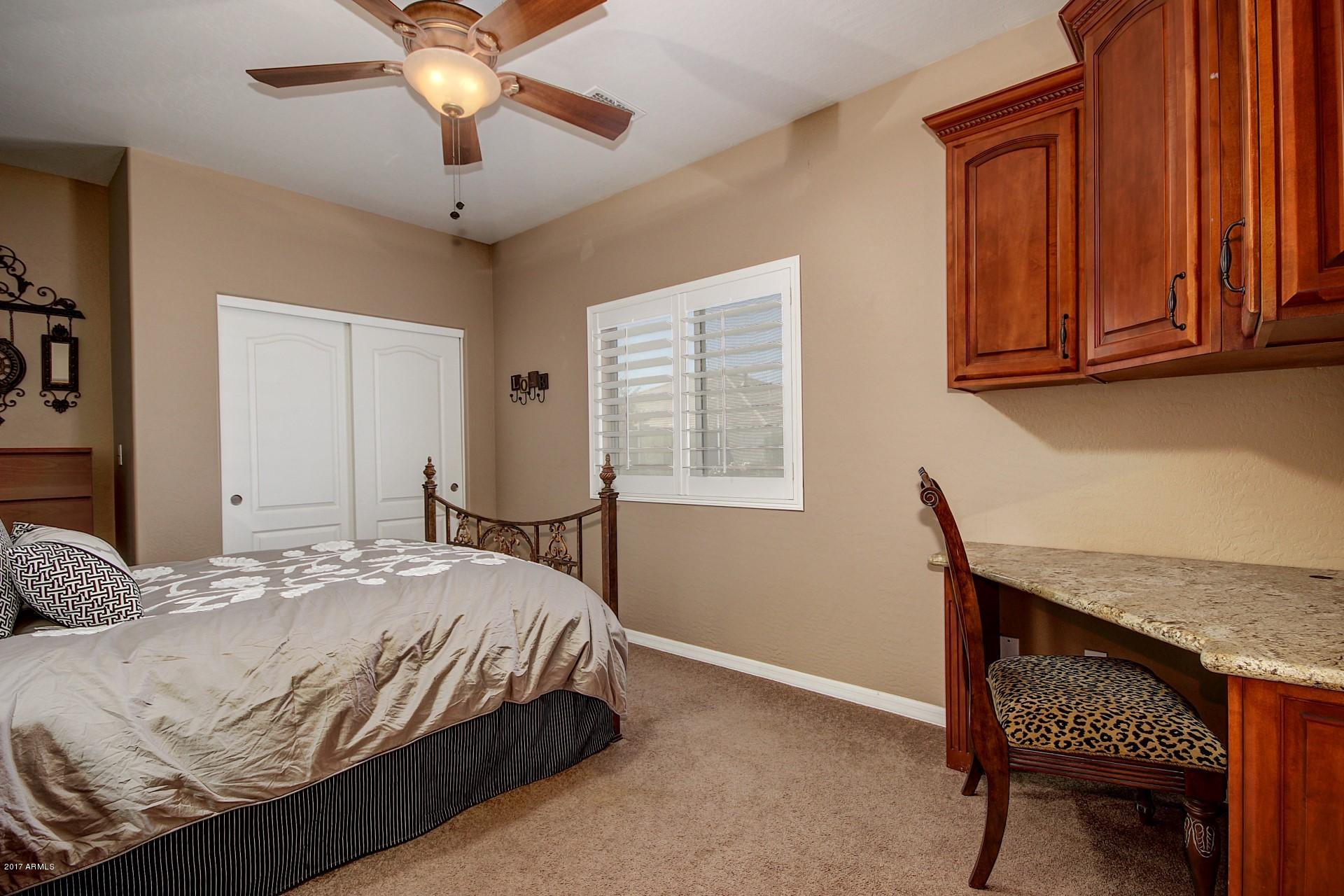 21982 East Rosa Road Queen Creek, AZ 85142 - Photo 20 of 40 a bedroom with a bed and dresser
