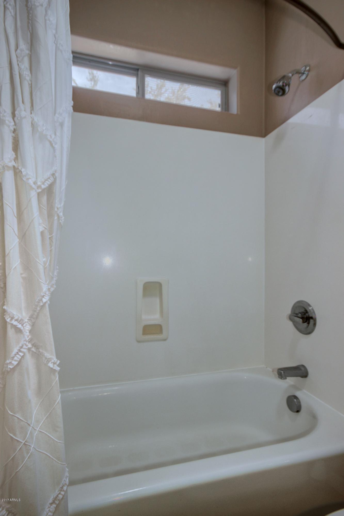 21982 East Rosa Road Queen Creek, AZ 85142 - Photo 23 of 40 a bathroom with a bathtub
