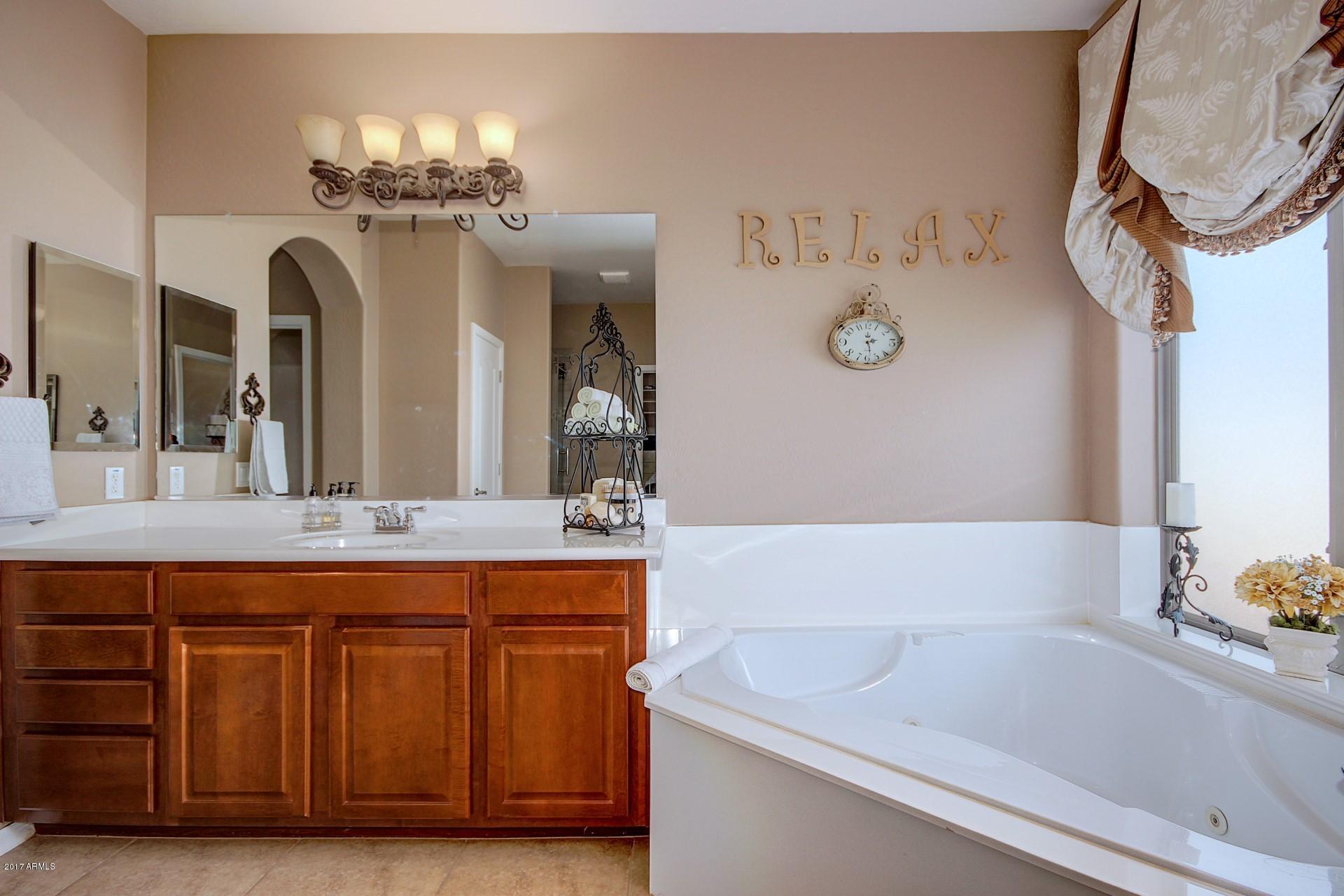21982 East Rosa Road Queen Creek, AZ 85142 - Photo 31 of 40 a bathroom with a sink and a mirror