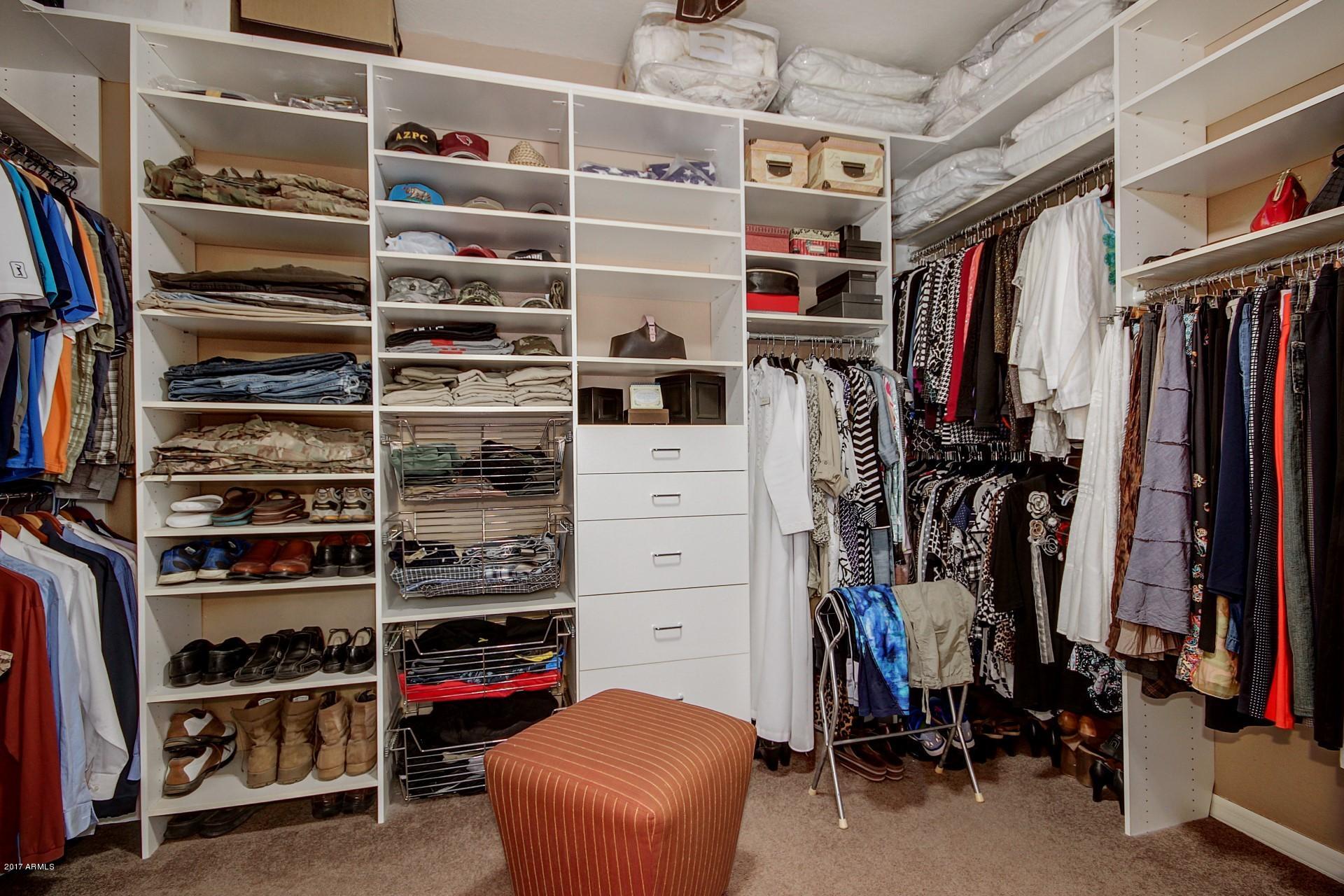 21982 East Rosa Road Queen Creek, AZ 85142 - Photo 34 of 40 a view of walk in closet with clothes and shoes