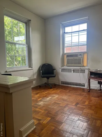 a room with a window and a bath tub