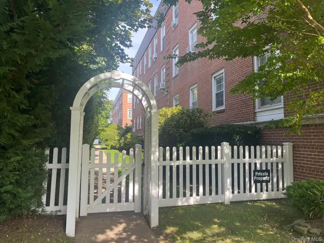a view of a house with backyard and porch