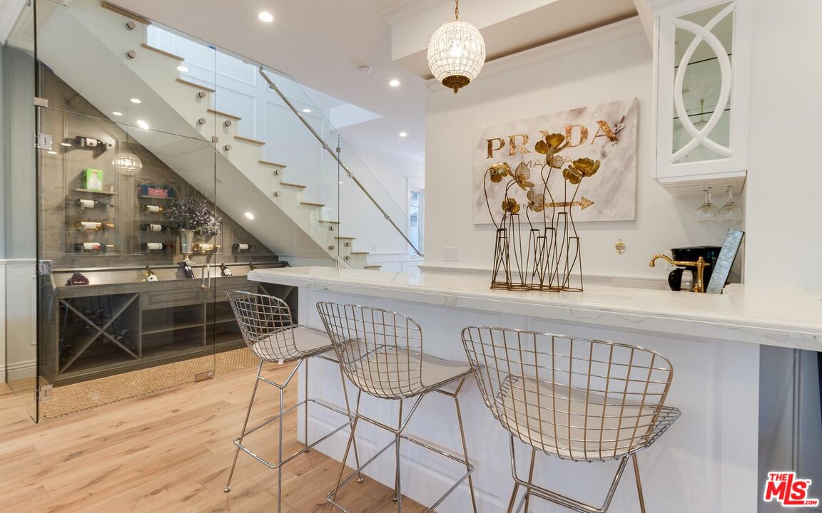 109 Geneva Walk Long Beach, CA 90803 - Photo 12 of 53 a very nice looking dining room with wooden floor and a chandelier fan