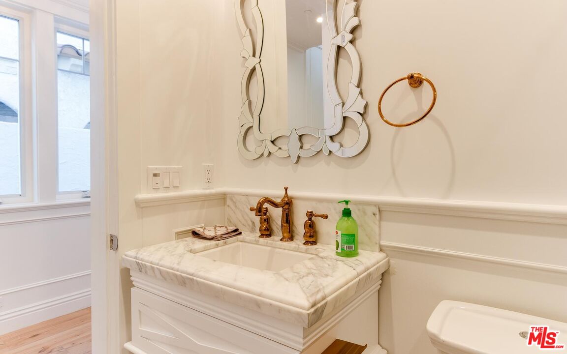 109 Geneva Walk Long Beach, CA 90803 - Photo 21 of 53 a bathroom with a sink vanity and toilet