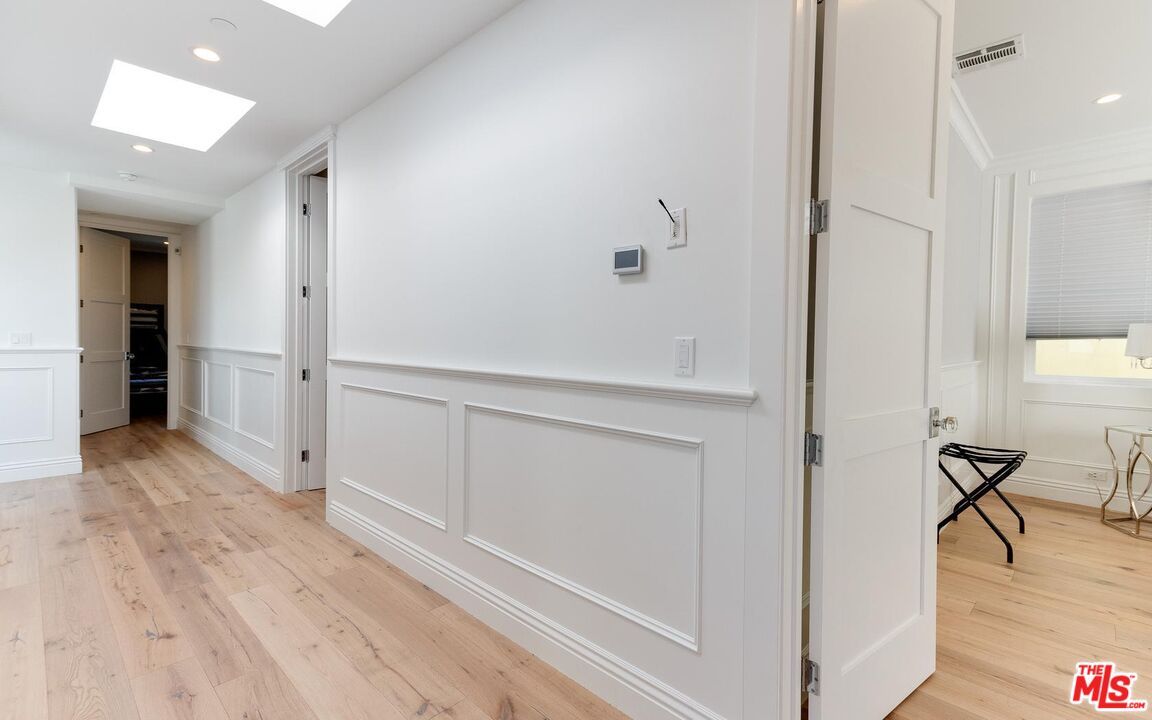 109 Geneva Walk Long Beach, CA 90803 - Photo 35 of 53 a view of a hallway with wooden floor and closet