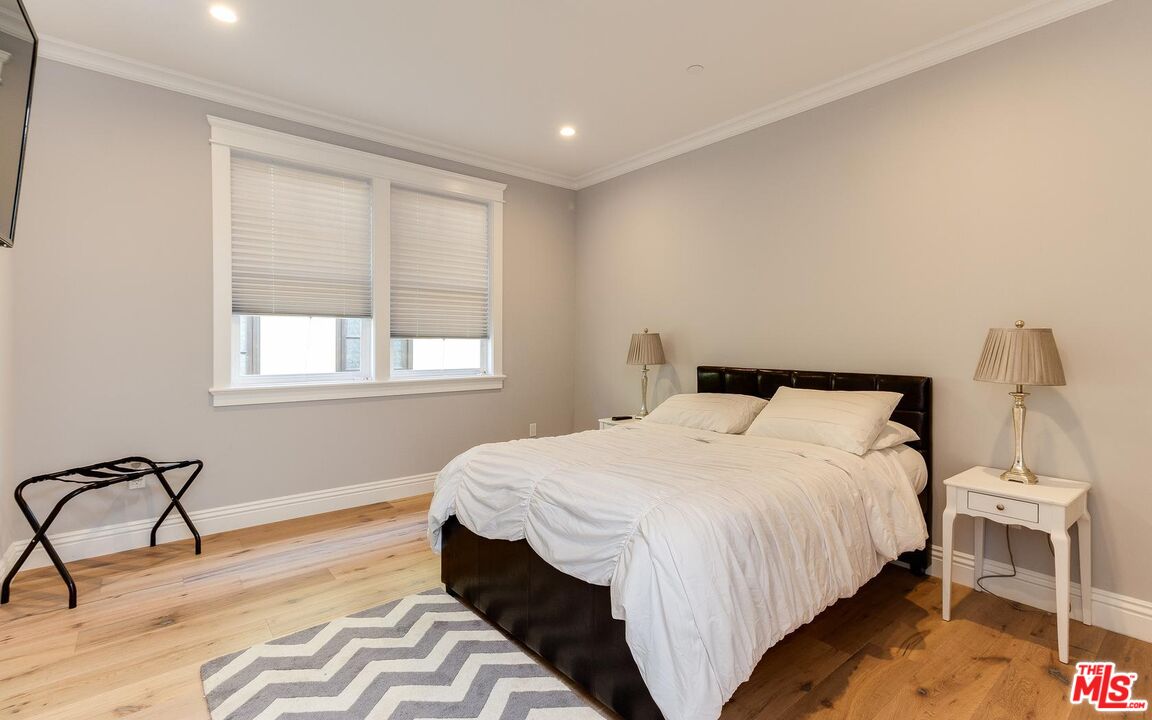 109 Geneva Walk Long Beach, CA 90803 - Photo 36 of 53 a bedroom with a bed and a window