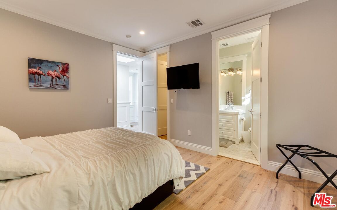 109 Geneva Walk Long Beach, CA 90803 - Photo 37 of 53 a bedroom with a bed and a flat screen tv