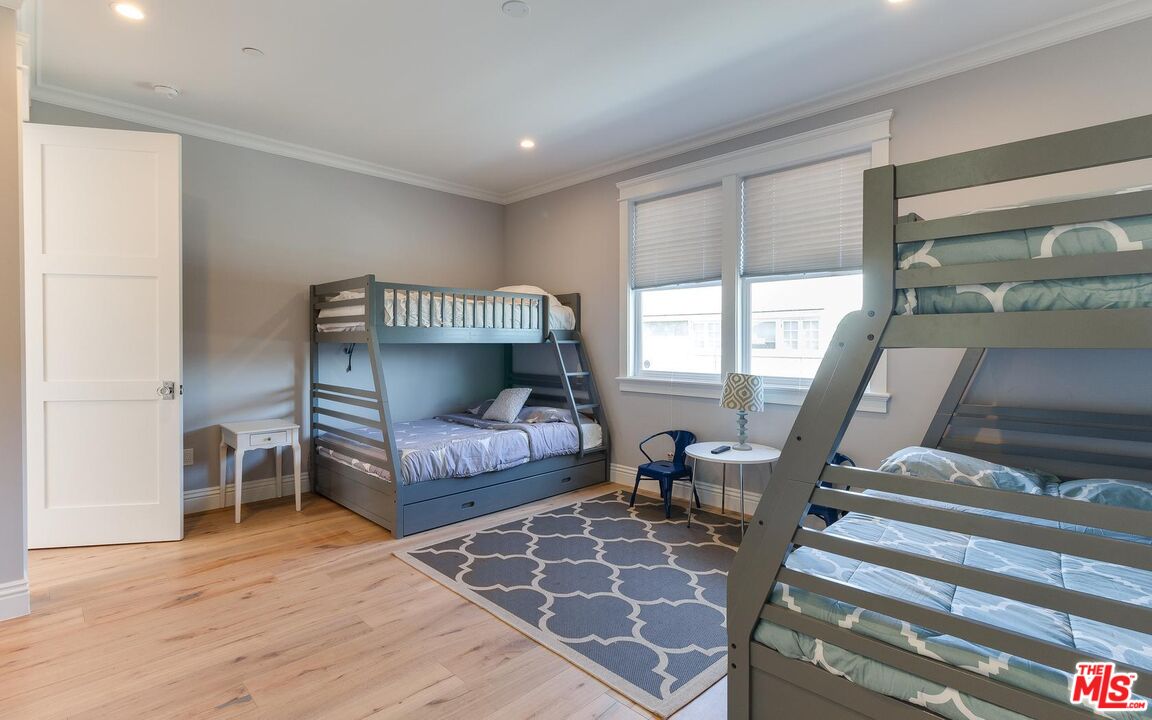 109 Geneva Walk Long Beach, CA 90803 - Photo 40 of 53 a living room with furniture and a floor to ceiling window