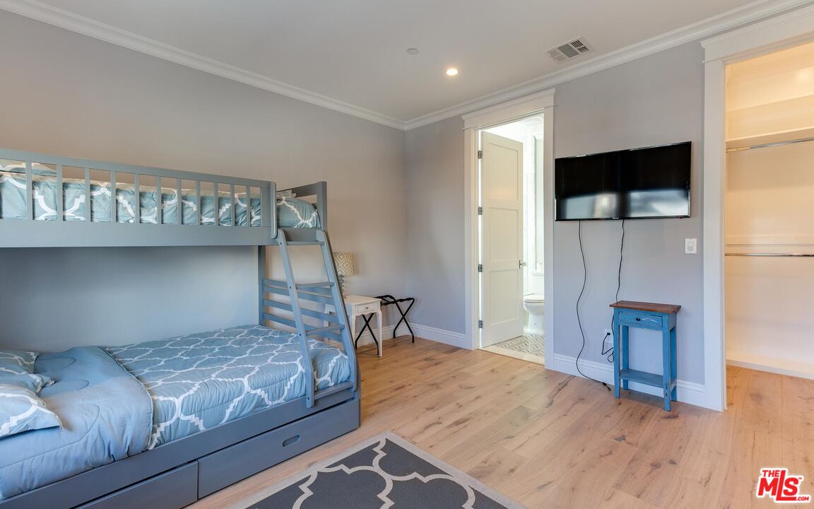 109 Geneva Walk Long Beach, CA 90803 - Photo 41 of 53 a bedroom with a bed and a flat screen tv