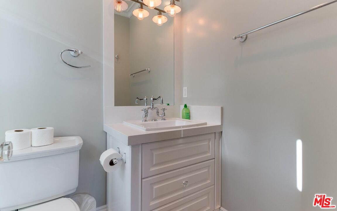 109 Geneva Walk Long Beach, CA 90803 - Photo 42 of 53 a bathroom with a sink mirror vanity and toilet
