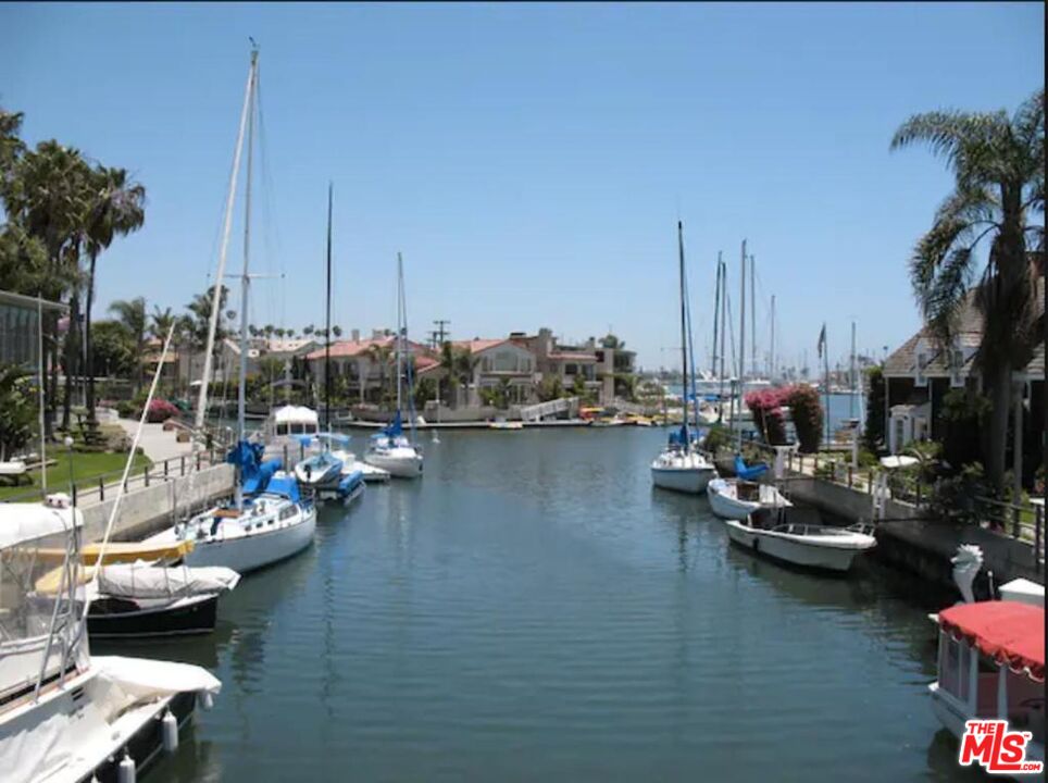 109 Geneva Walk Long Beach, CA 90803 - Photo 5 of 53 a view of a lake with boats next to a bridge