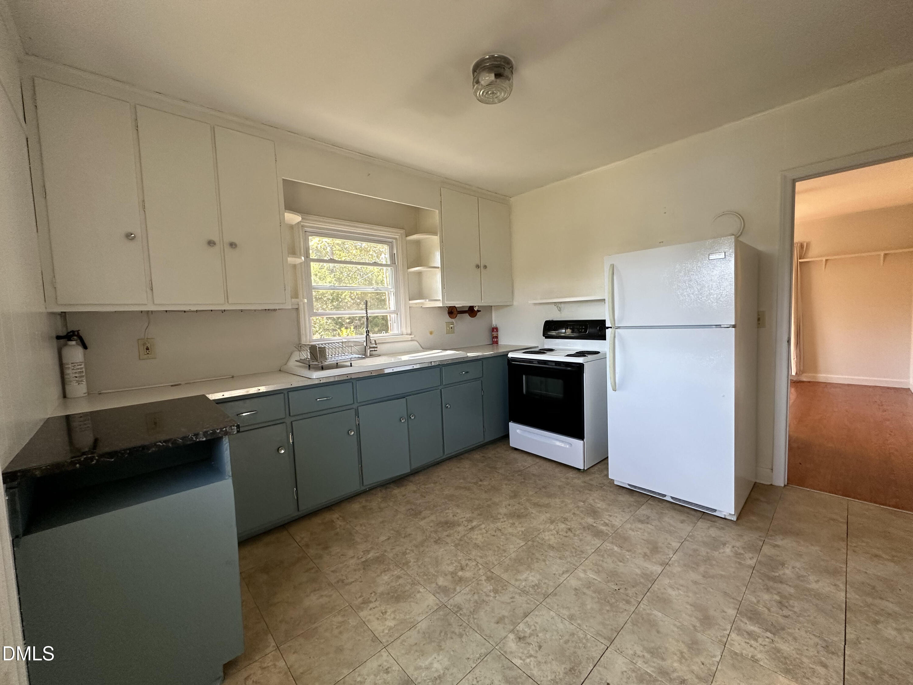 0 Kerley Road Durham, NC 27705 - Photo 2 of 10 a kitchen with a refrigerator sink and cabinets