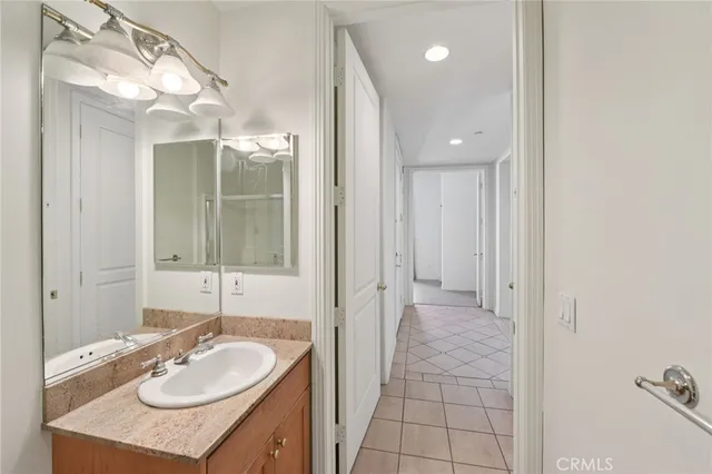 a bathroom with a sink double vanity and a mirror