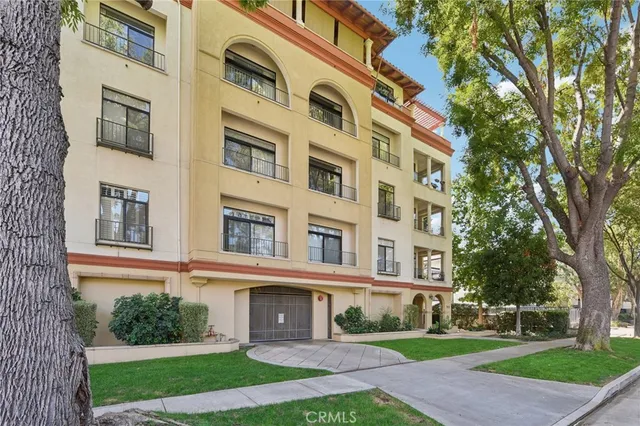 a view of a building with a yard