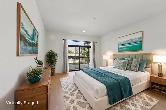 a bedroom with bed and large window