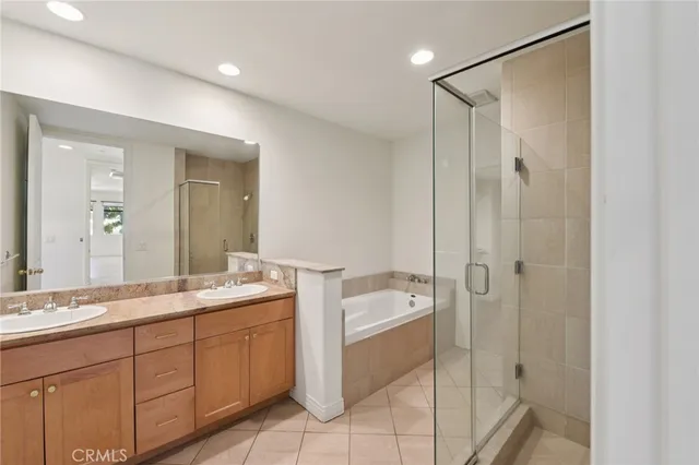 a spacious bathroom with a double vanity sink mirror and double