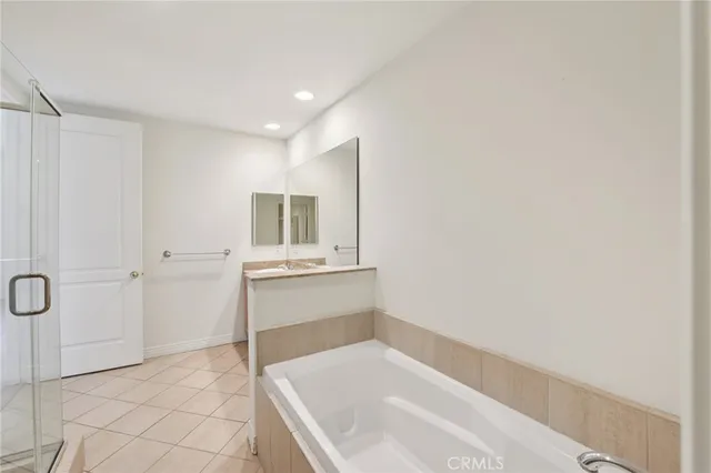 a bathroom with a bathtub and a sink