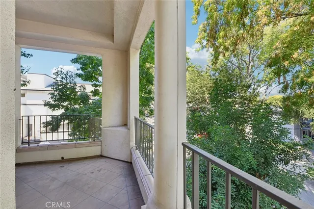 a view of a balcony with an outdoor space