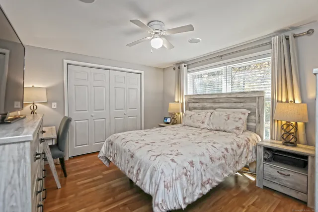 a bedroom with a bed and a table in it