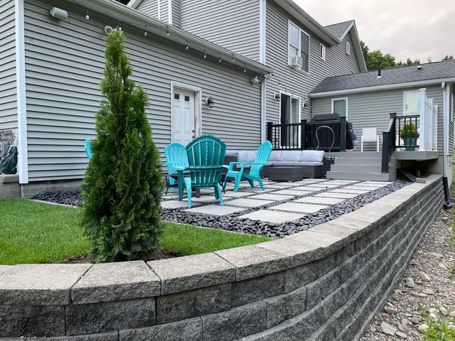 a view of a house with backyard sitting area and garden