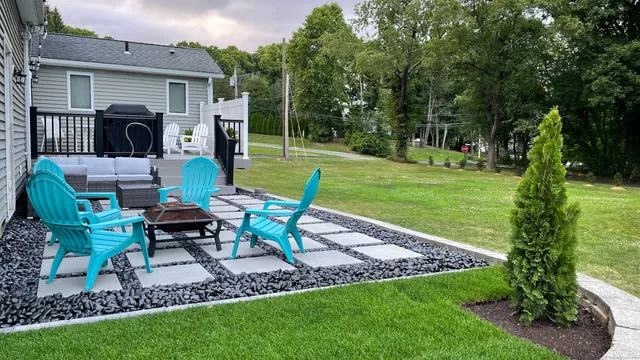 a view of a patio with chair table and chairs