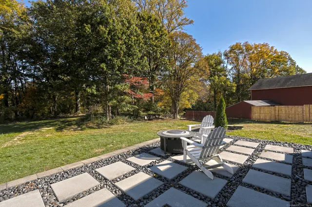 a view of a park with bench and a trees