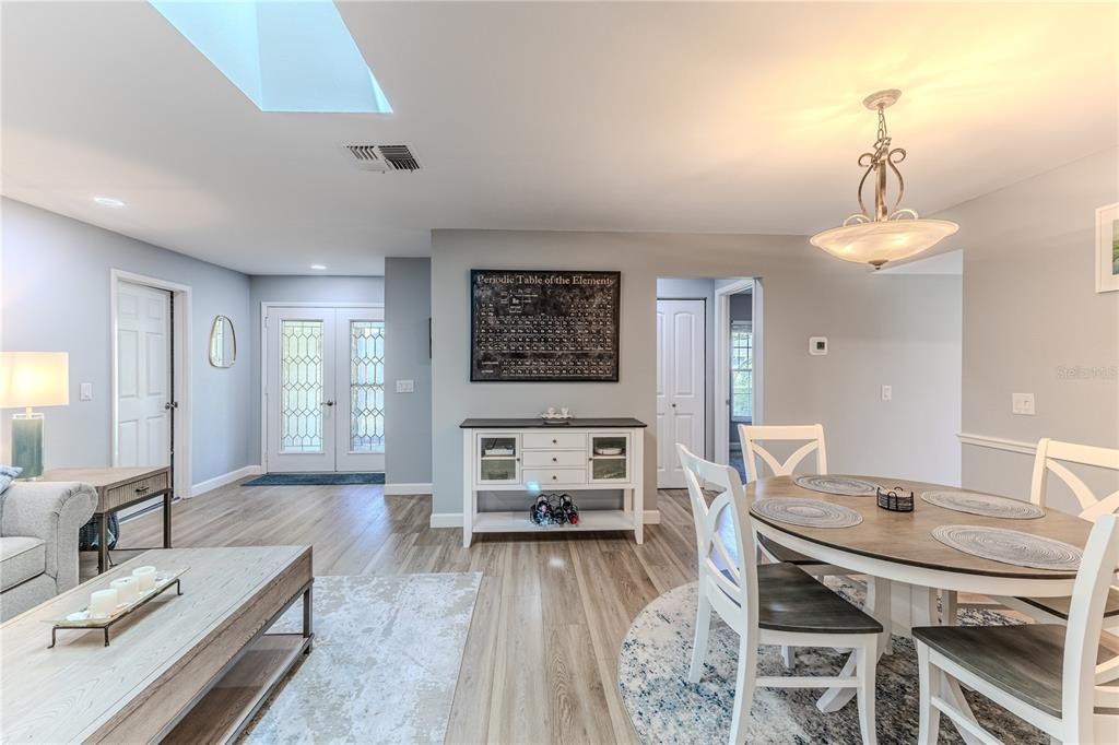 6428 Plantation Road Spring Hill, FL 34606 - Photo 13 of 50 a living room with furniture and a table