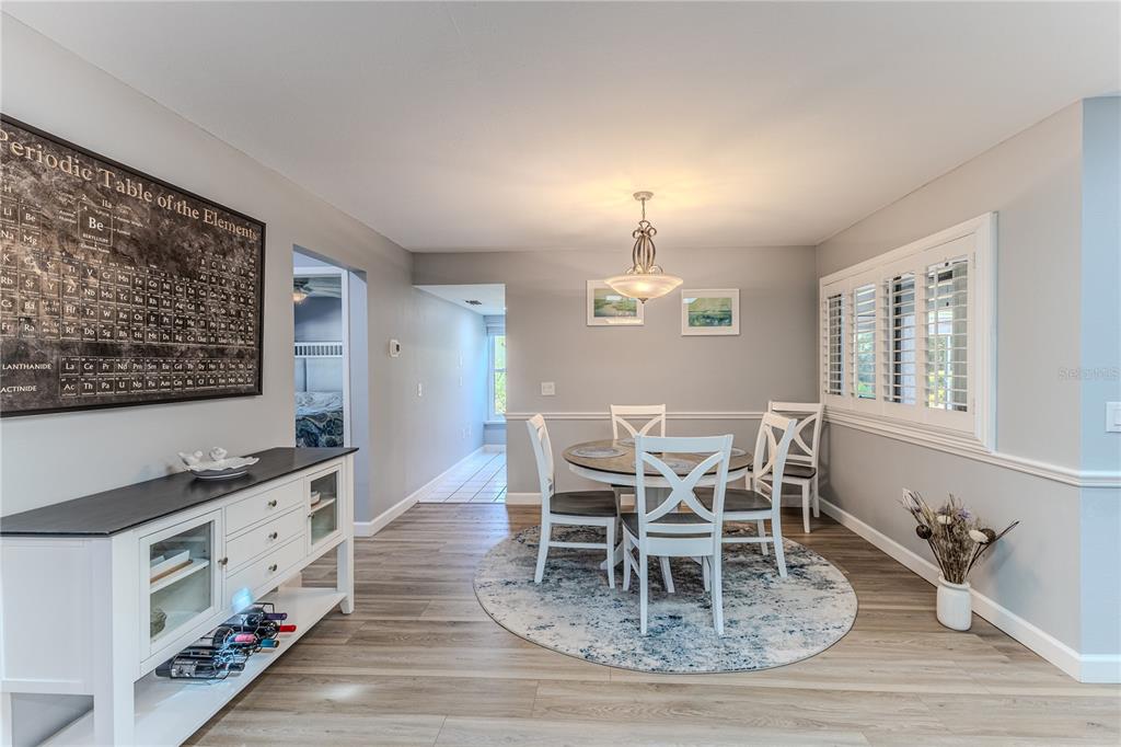 6428 Plantation Road Spring Hill, FL 34606 - Photo 14 of 50 a view of a dining room with furniture