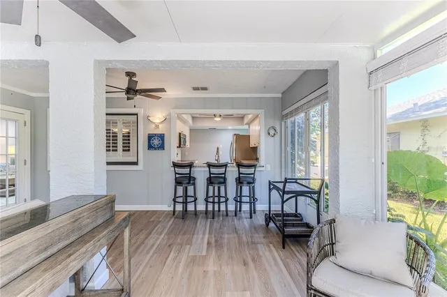 a view of a house with a backyard and a tree