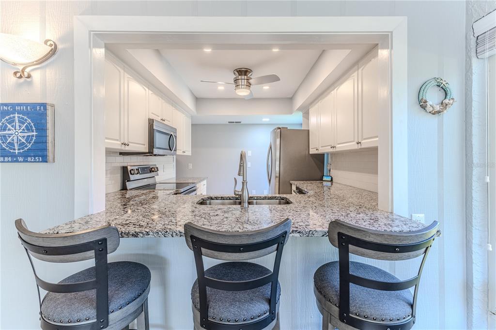 6428 Plantation Road Spring Hill, FL 34606 - Photo 20 of 50 a dining room with furniture and window