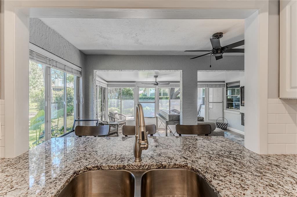 6428 Plantation Road Spring Hill, FL 34606 - Photo 25 of 50 a view of living room and kitchen floor