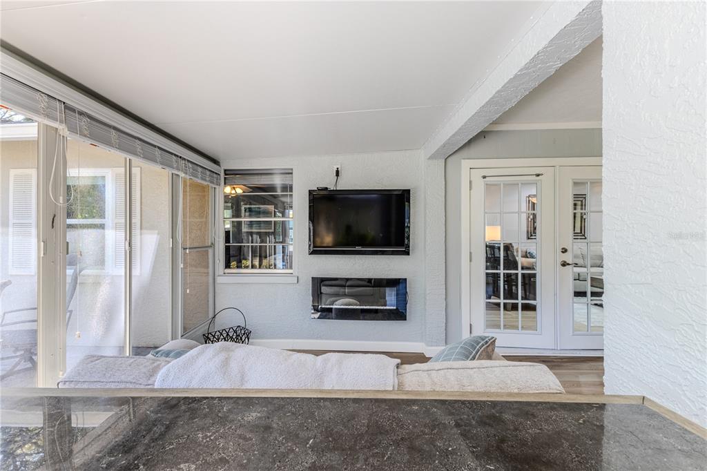 6428 Plantation Road Spring Hill, FL 34606 - Photo 43 of 50 a living room with furniture and a flat screen tv